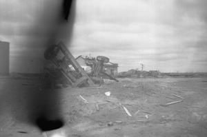 Primary view of object titled '[Photograph of an Overturned Tractor After Tornado]'.