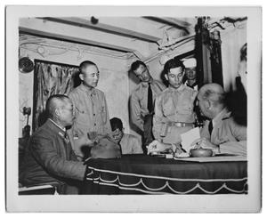 Primary view of object titled '[U.S. and Japanese officers during surrender negotiations]'.