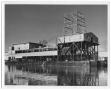 Thumbnail image of item number 1 in: '[Photograph of Large Building on Water]'.