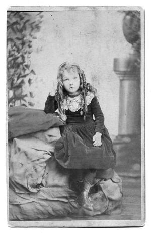 Primary view of object titled '[Young girl sitting with legs crossed]'.