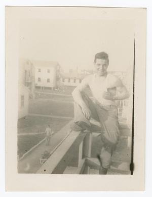 Primary view of object titled '[Man Sitting on a Balcony]'.