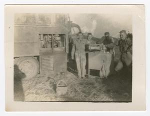 Primary view of object titled '[Men Standing Around a Box]'.