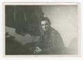 Photograph: [Photograph of a Sitting and Smiling Soldier]