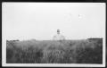 Photograph: [Man standing in field]