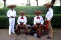 Primary view of [Four unidentified men in Mexican sombreros at a reception held at Denton City Hall]