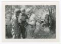 Photograph: [Soldiers Discussing Cases]
