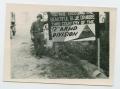 Thumbnail image of item number 1 in: '[Soldier Standing by Sign]'.