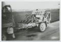 Photograph: [Soldiers Riding in a Trailer Behind a Truck]