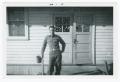 Photograph: [Soldier in Front of Mess Hall]