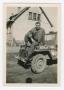 Photograph: [Staff Sergeant Franklin Frobisher Sitting on the Hood of a Jeep]