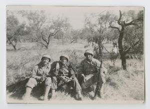 Primary view of object titled '[Three Soldiers Sitting in a Lightly Wooded Field]'.