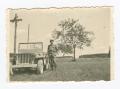 Thumbnail image of item number 1 in: '[Harry Parsloe Leaning on a Jeep]'.
