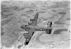 Primary view of object titled 'C-87 plane in flight'.