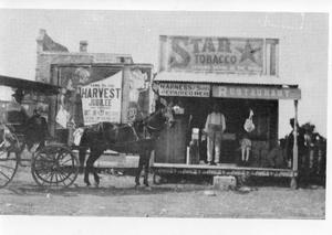 Primary view of object titled '[Buggy with horse in front of store]'.