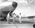 Photograph: Three Men with Convair Airplane