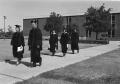 Primary view of [Photograph of Faculty Walking to Commencement]