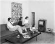 Primary view of Mr. and Mrs. Middleton and family watch Television