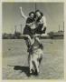Photograph: [Photograph of HSU Cowgirls on Man's Shoulders]