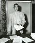 Photograph: [Photograph of Ken Wright with Papers]