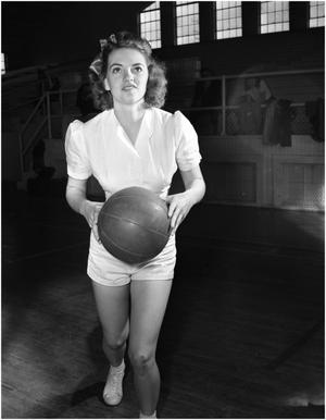 Primary view of object titled 'Ida Jean Smith playing basketball'.