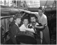 Photograph: Three Thompson Sisters and KFJZ's Radio Technician Jerry Hahn