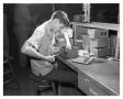 Photograph: James Burnham working in the Electrical & Radio Bench Department