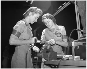 Primary view of object titled '[Two Women Performing Mechanical Work]'.