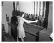 Photograph: [Dorothy Keys Operating Tube Station in the Mail Room]
