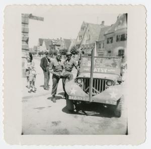 Primary view of object titled '[Soldiers Standing by Jeep]'.