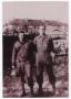 Primary view of [James Sadler and Pete Vickless in Front of Zimming Barracks]