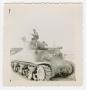 Photograph: [William Giannopoulos Standing on a Tank with a Machine Gun]