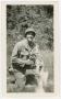 Photograph: [Soldier Holding a Canteen]