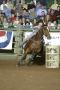 Primary view of [Woman and Horse Barrel Racing at Cowtown Coliseum]