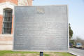 Photograph: [Memorial Plaque for Jesse Grimes and Mathew Caldwell]