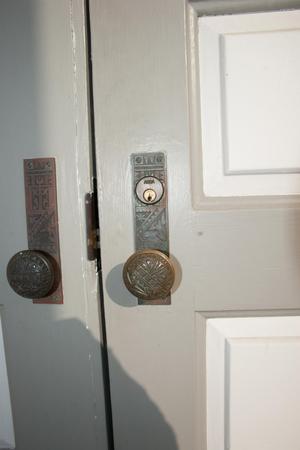 Primary view of object titled '[Close-Up of Door Knobs]'.