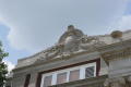Photograph: [Stone Carving on Top of Courthouse]