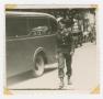 Photograph: [U.S. Army Soldier Walking on a Street]