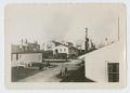 Photograph: [Truck Parked by Barracks]
