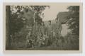 Photograph: [Soldiers In Front of Buildings]