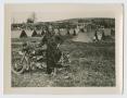 Photograph: [Soldier with Motorcycle]