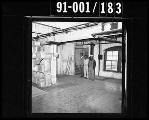 Primary view of object titled 'Three Men at the Texas School Book Depository [Negative]'.