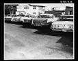 Photograph: Row of Cars in Parking Lot [Print]
