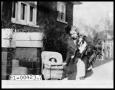 Photograph: Maxine Walker Perini as a Child with Pet Dog and Doll in Doll Buggy