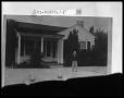 Photograph: Child by House