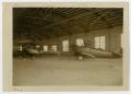 Thumbnail image of item number 1 in: '[Two Biplanes in Hangar]'.