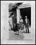 Photograph: [Photograph of a Man and Woman by Front Porch]