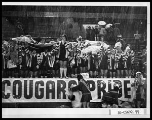 Primary view of object titled 'Cooper High Pep Squad in Rain'.