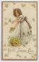 Primary view of [Postcard of Girl With Basket of Yellow Flowers]