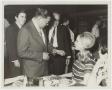 Photograph: [Photograph of Dr. Kim Talking with Students]