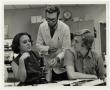 Thumbnail image of item number 1 in: '[Photograph of Dr. Ben Pilcher With Two Students]'.
